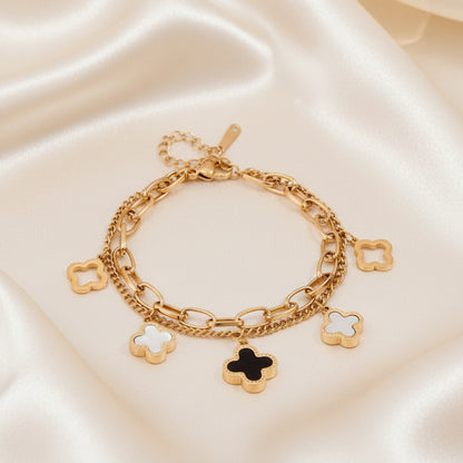 Double layered charm bracelet with clover and heart lucky symbols