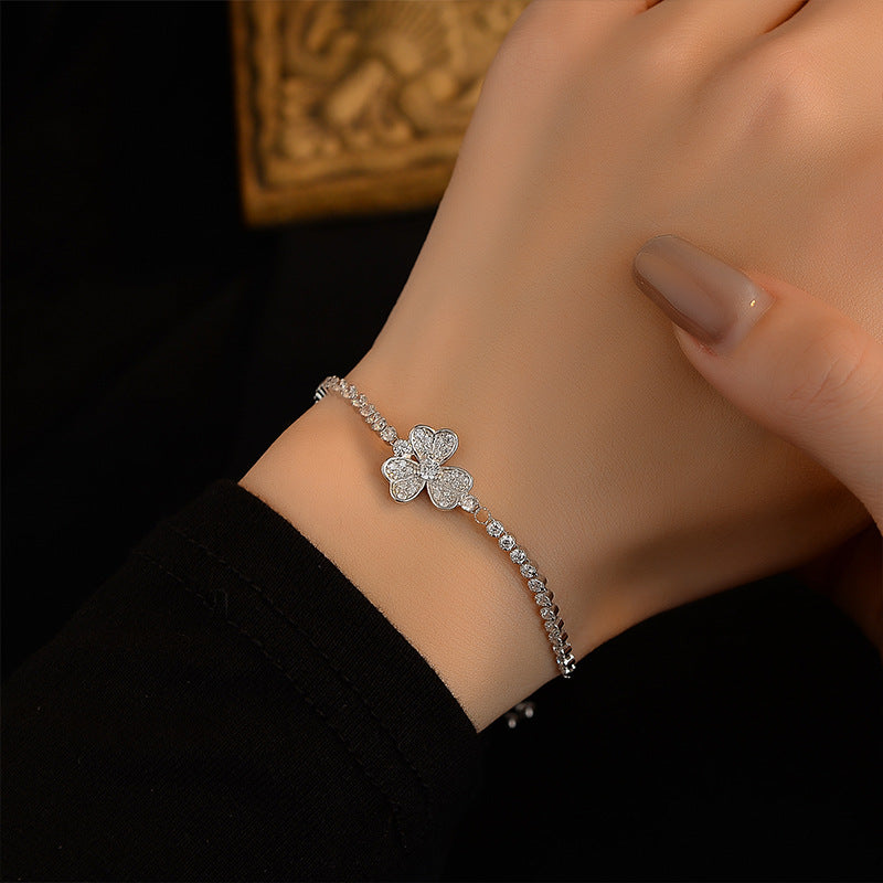 Adjustable sliding bracelet with flower petal charm minimalist style