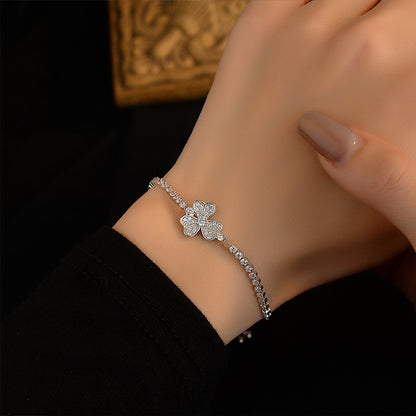 Adjustable sliding bracelet with flower petal charm minimalist style