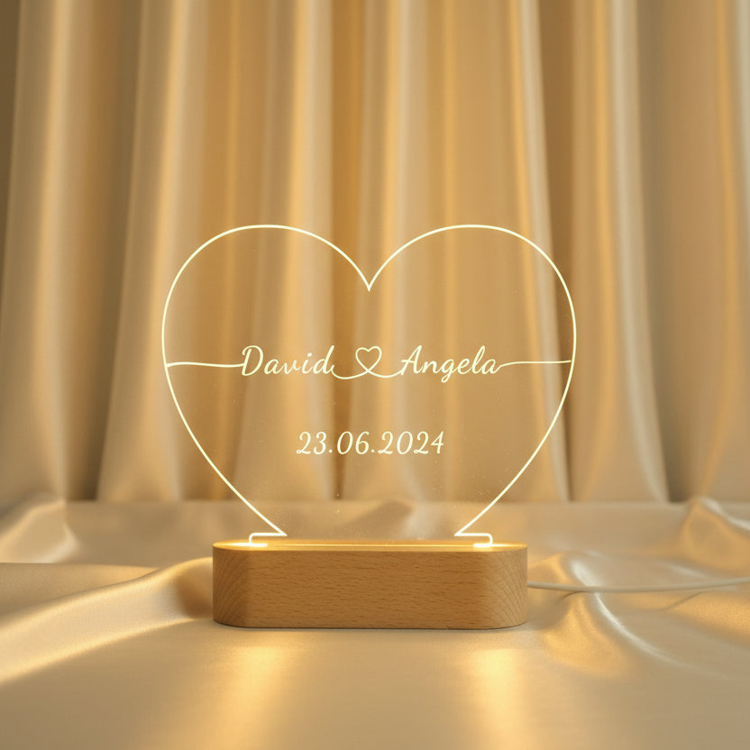 Custom engraved acrylic heart night light with couple names and date glowing warm led