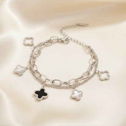 Double layered charm bracelet with clover and heart lucky symbols