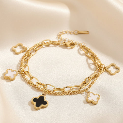 Double layered charm bracelet with clover and heart lucky symbols